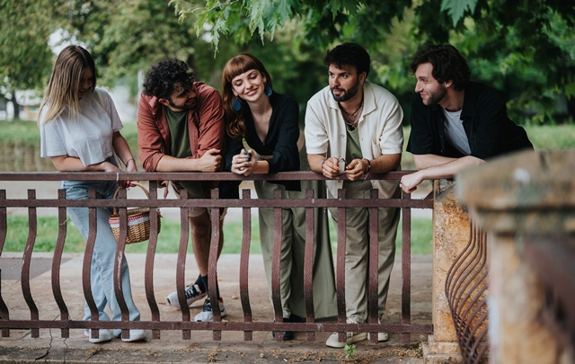 Group of friends enjoying leisure time outdoors in a serene park setting